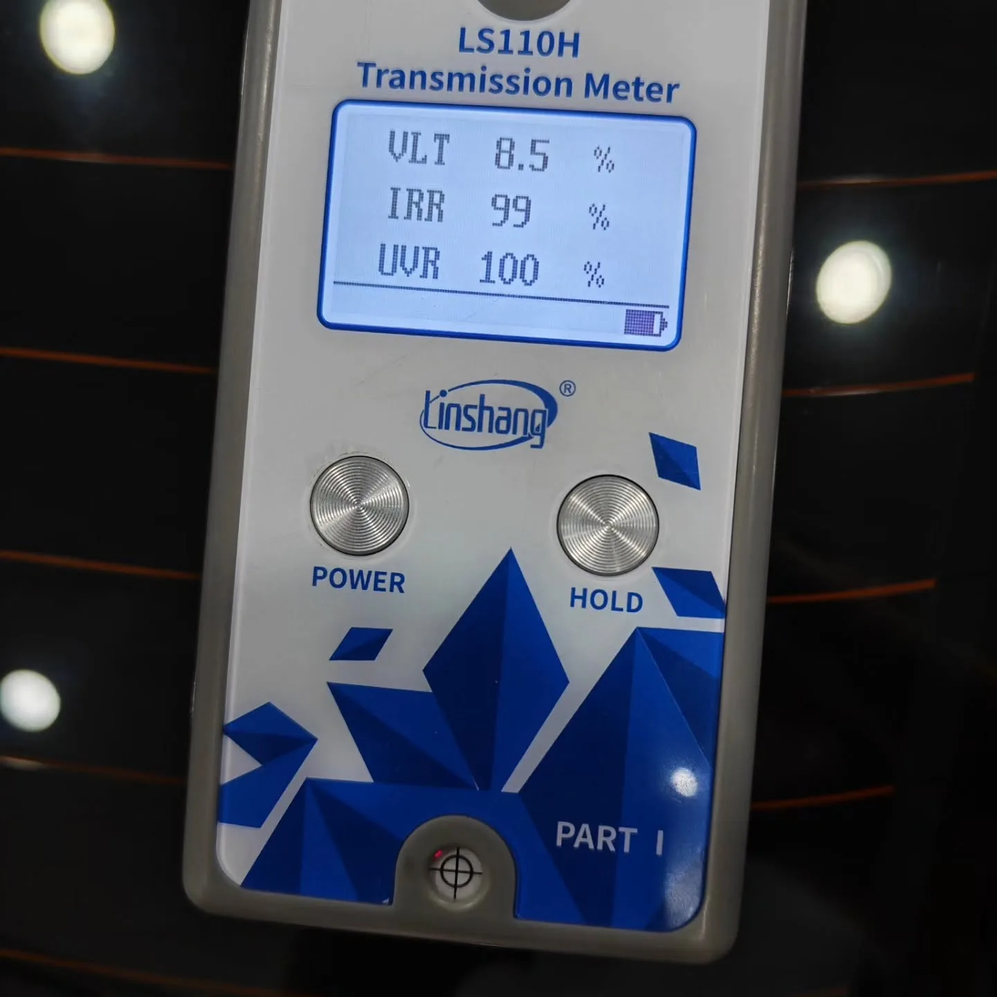Transmission meter held against the Honda City’s rear window